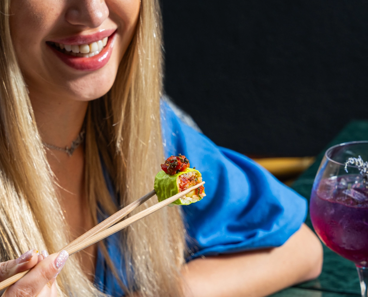 Best Japanese kitchens in Dubai Guest tasting sushi at Blume Restaurant Dubai