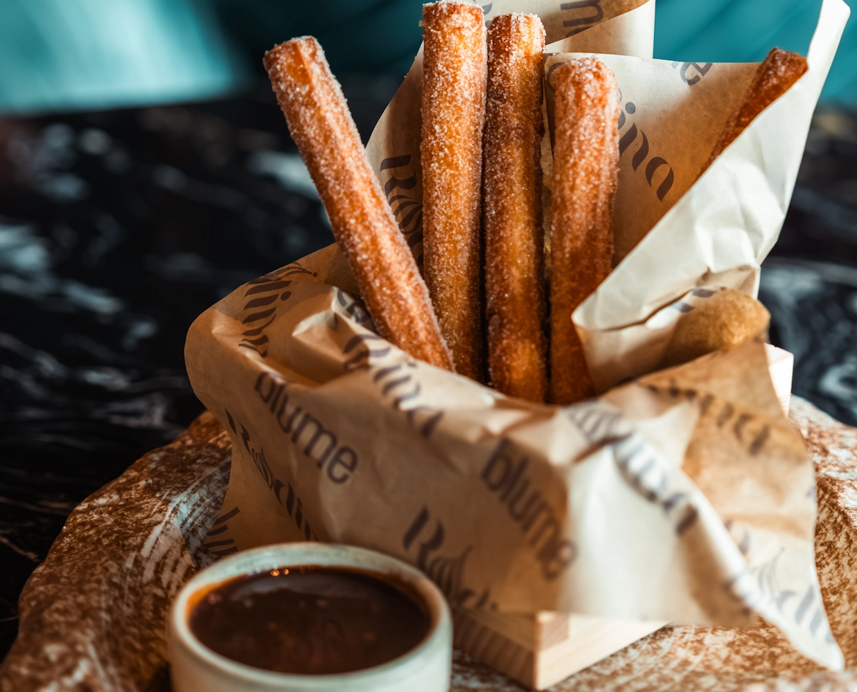 Best appetizers in Dubai Churros with chocolate sauce at Blume Restaurant Dubai
