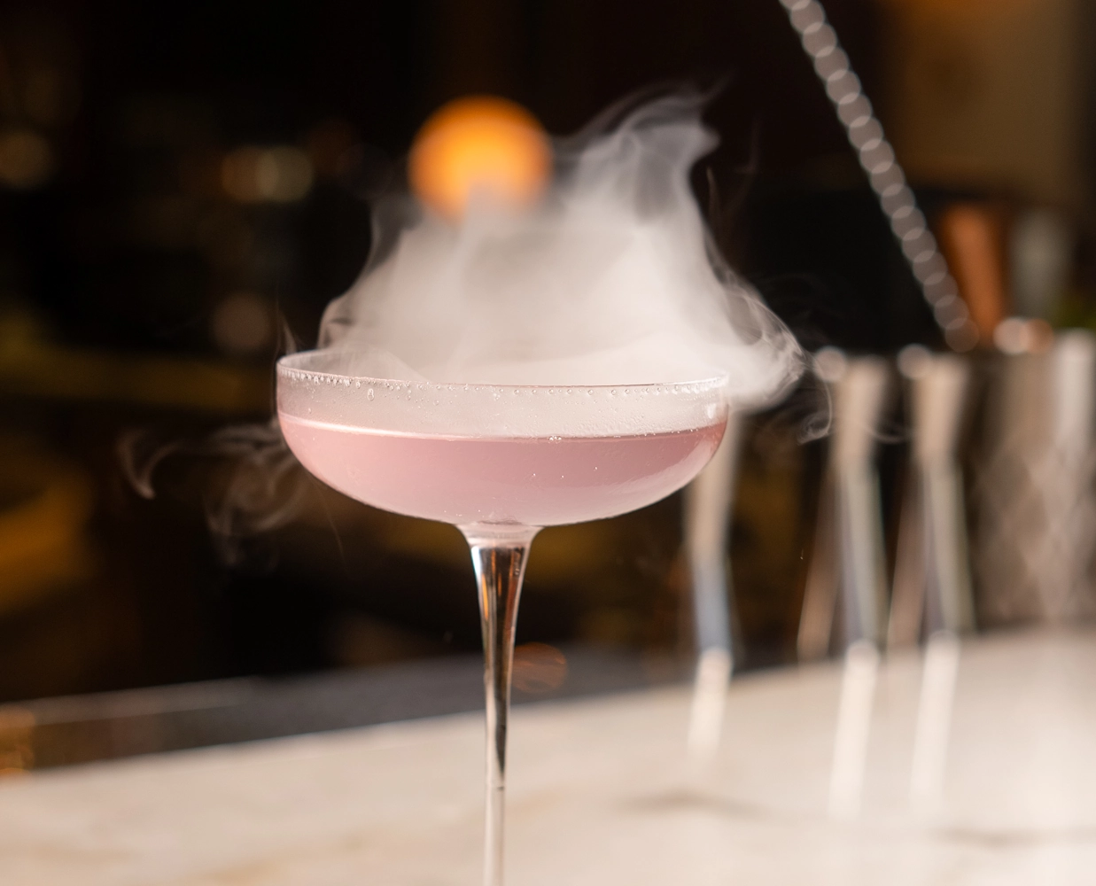 Best drink selections in Dubai Smoky cocktail served at Blume Restaurant Dubai