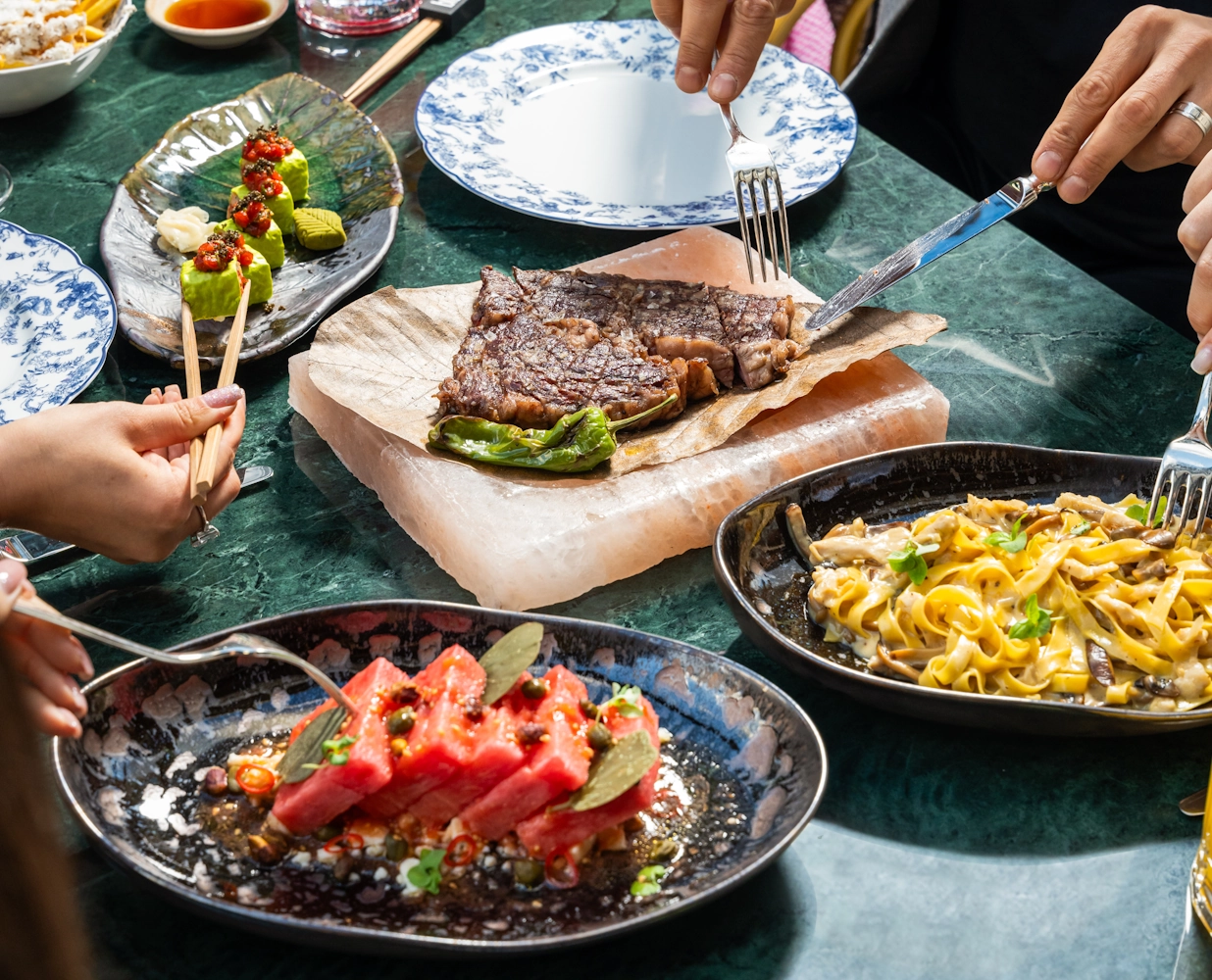 Grilled meat and salad dishes at Blume Restaurant Dubai