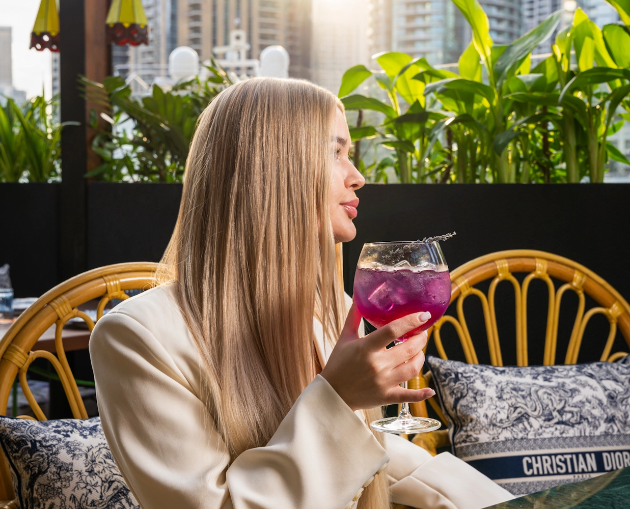 Best mocktail in Dubai Guest enjoying a purple cocktail at Blume Restaurant Dubai