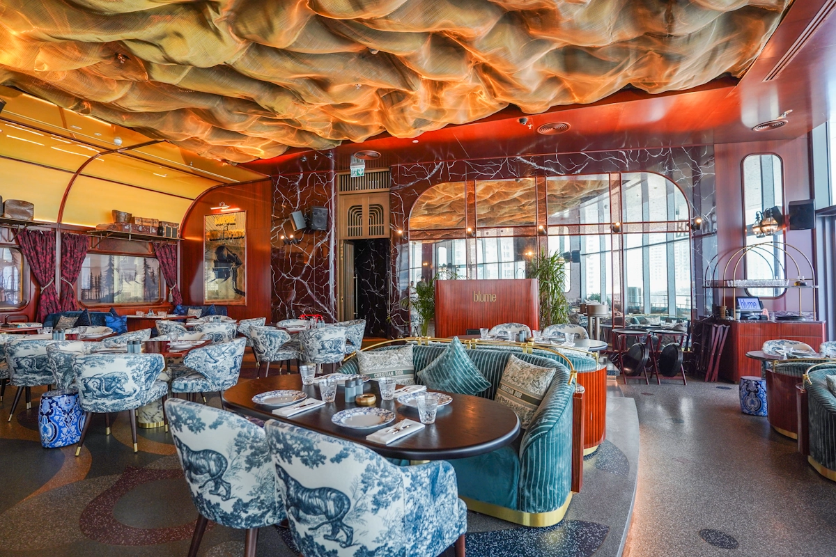 Blume Dubai Mall atmosphere Luxury dining area with orange ceiling at Blume Restaurant Dubai