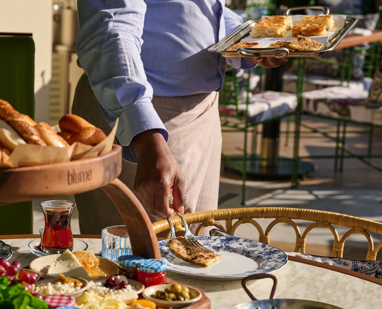 Turkish breakfast in Dubai Mall Server presenting breakfast at Blume Restaurant Dubai
